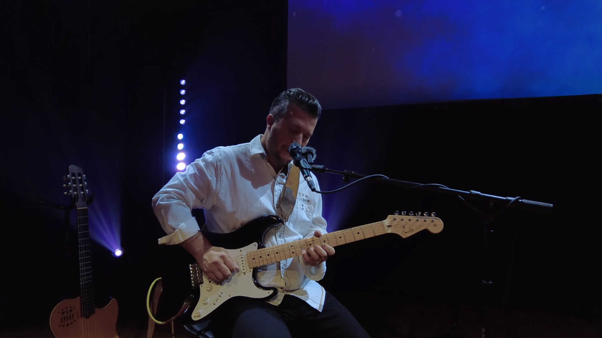 Close-up of DannyO's hands on the guitar